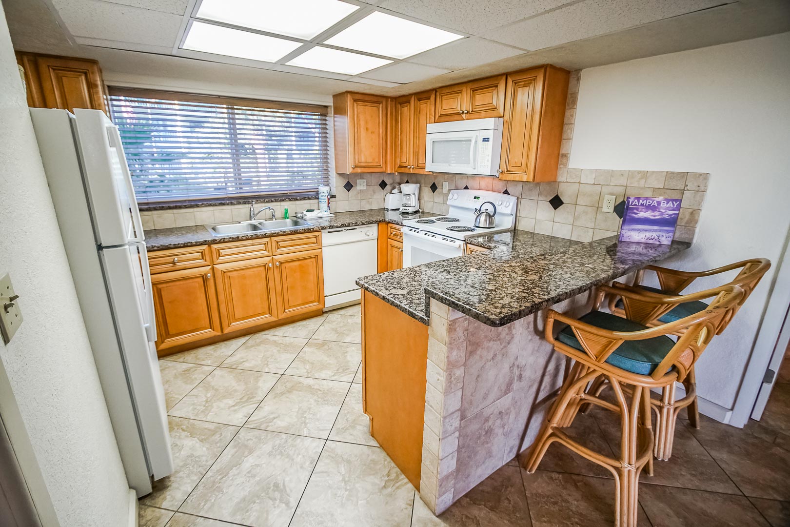 A fully equipped kitchen at VRI's Coral Reef Beach Resort in St. Pete Beach, Florida.